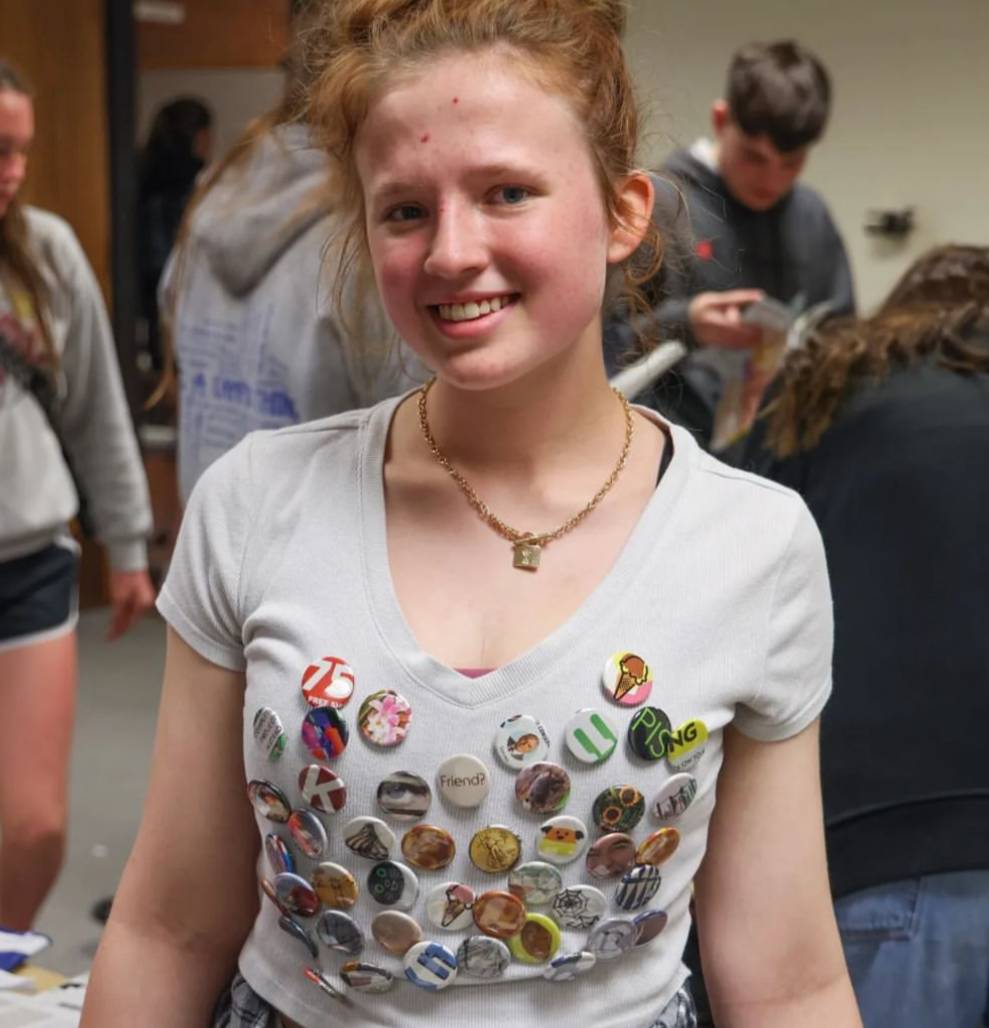 Student wearing a shirt covered in buttons