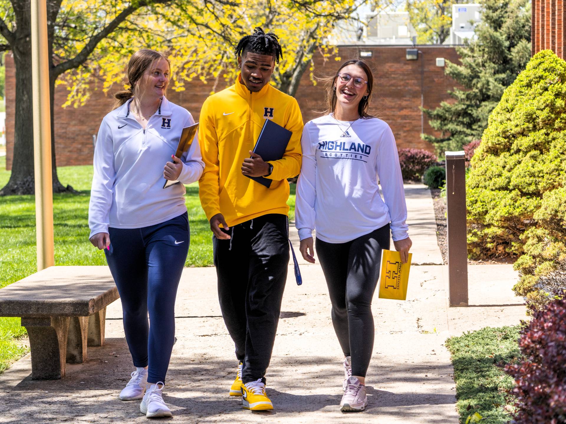 Three students touring campus