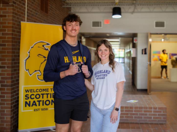 Two students standing together.