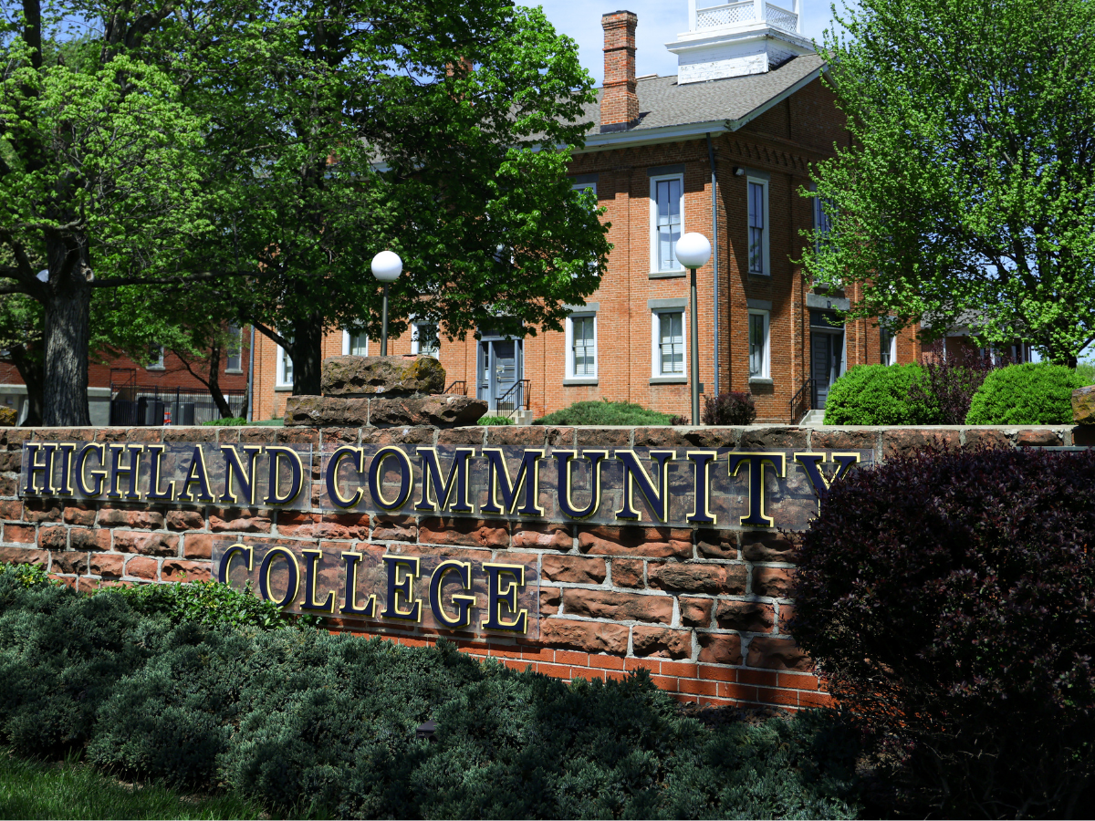 Highland Campus sign with Irvin Hall in background