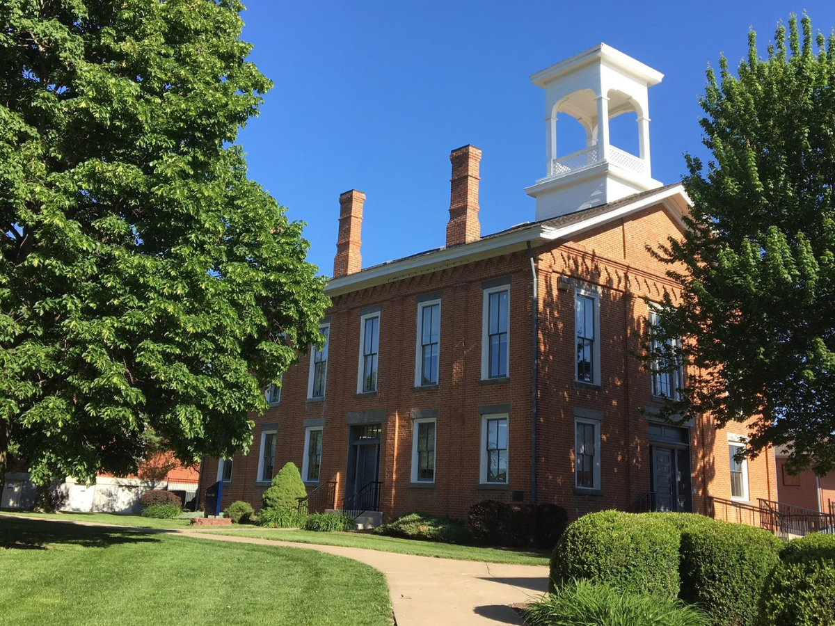 Irvin Hall, the oldest building on campus, is a brick two story building.
