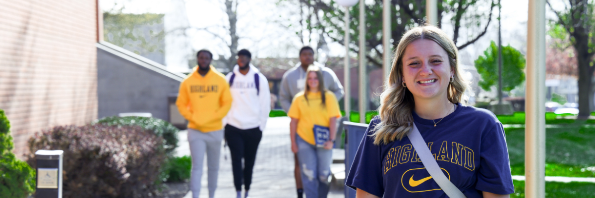 Student smiles at the camera